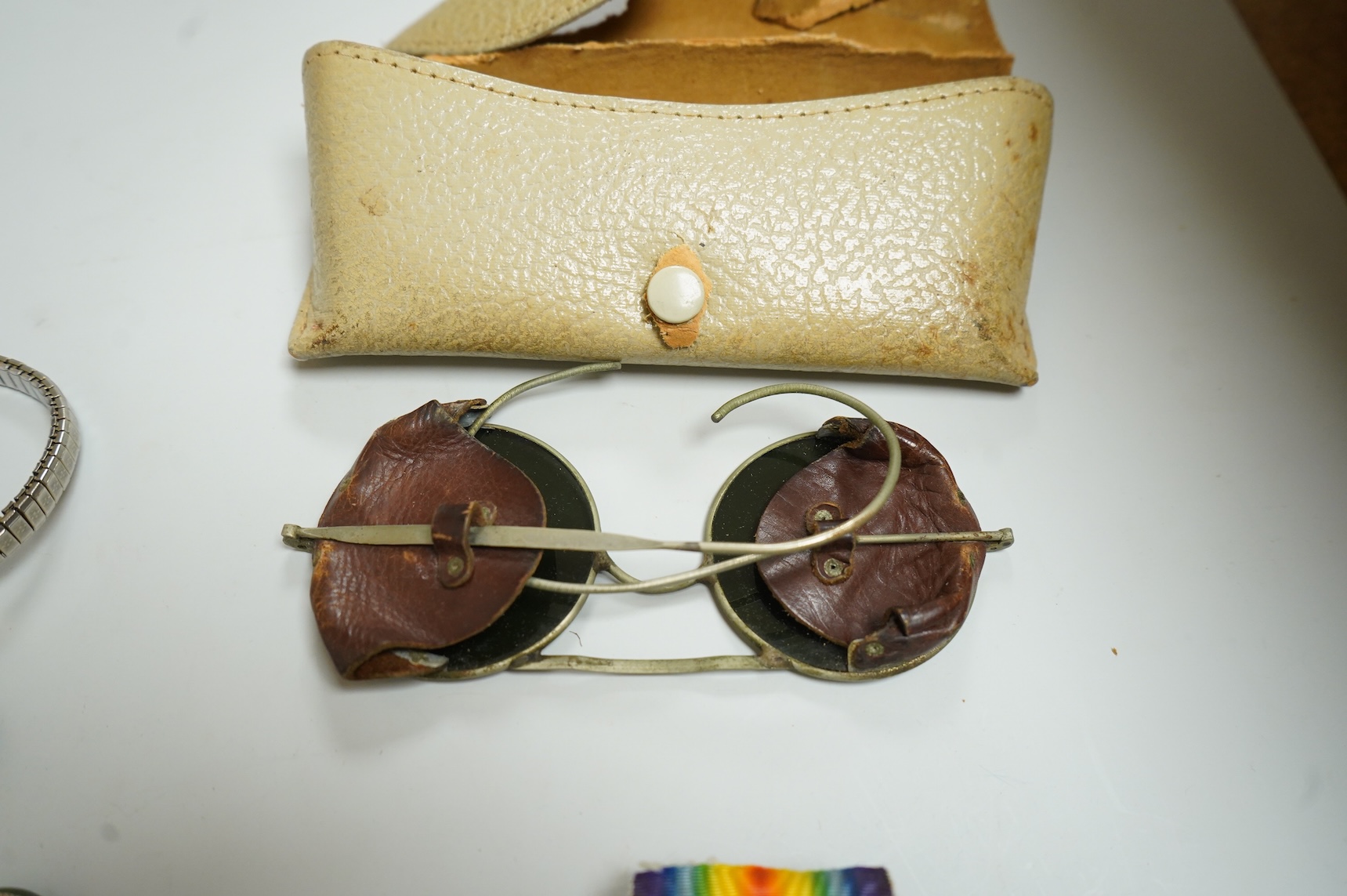Assorted collectables including medals, aviator's glasses and costume jewellery and an antique seal